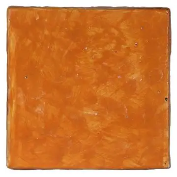 Hand-painted orange Deruta tile by Antica Deruta, Italy. The tile is entirely handcrafted.