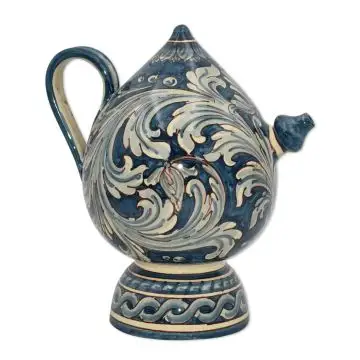 A blue and white "bummolo malandrino", a traditional jug from Sicily. It is handmade in Caltagirone, Italy. 
