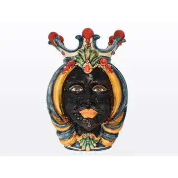 Sicilian head featuring a Moorish character decorated in rich shades of blue, orange and red. It is handcrafted in Caltagirone, Italy.