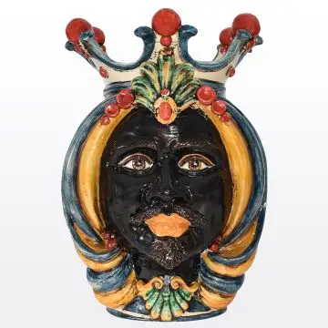 Sicilian head featuring a Moorish character decorated in rich shades of blue, orange and red. It is handcrafted in Caltagirone, Italy.