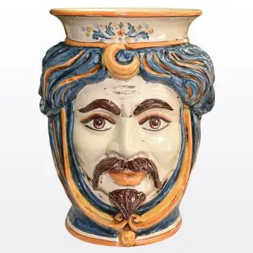 Sicilian Moorish head vase featuring a male character decorated in rich shades of blue and orange. It is handcrafted in Caltagirone, Italy.