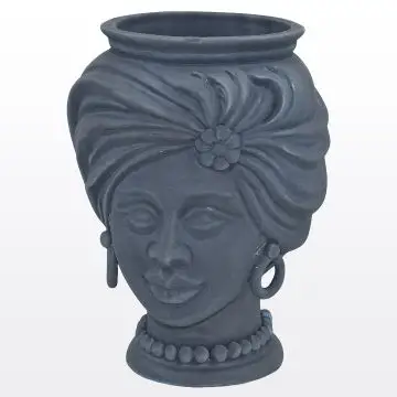 Matt blue Sicilian Moorish head featuring a female character. It is handcrafted in Caltagirone, Italy.