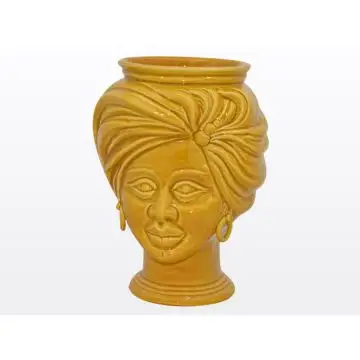 Yellow Sicilian Moorish head featuring a female character. It is handcrafted in Caltagirone, Italy.
