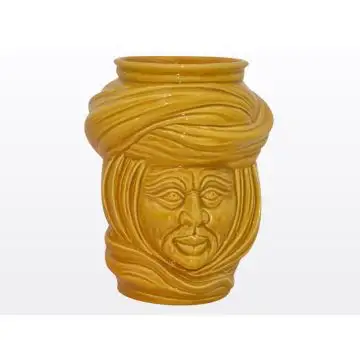 Yellow Sicilian Moorish head featuring a male character. It is handcrafted in Caltagirone, Italy.