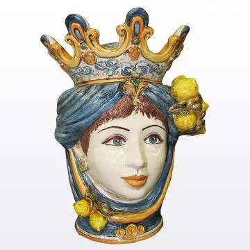 Sicilian Moorish head with lemons. It features a female character decorated in rich shades of blue and orange. It is handcrafted in Caltagirone, Italy. Large
