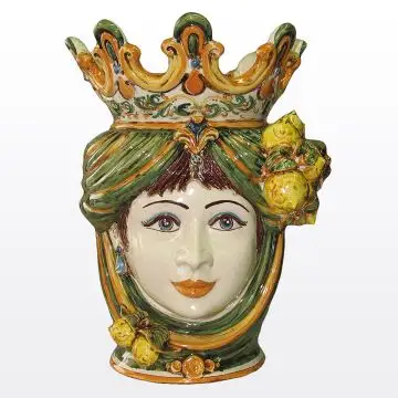 Sicilian Moorish head with lemons. It features a female character decorated in rich shades of green and orange. It is handcrafted in Caltagirone, Italy. Large