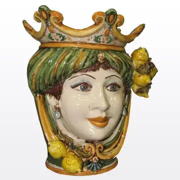 Sicilian Moorish head with lemons. It features a female character decorated in rich shades of green and orange. It is handcrafted in Caltagirone, Italy. Small
