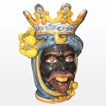 Sicilian head with lemons. It features a Moorish character decorated in rich shades of blue and orange. It is handcrafted in Caltagirone, Italy. Large