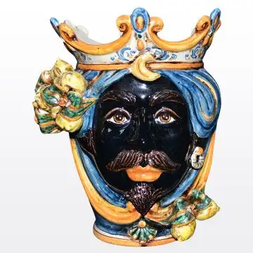Sicilian head with lemons. It features a Moorish character decorated in rich shades of blue and orange. It is handcrafted in Caltagirone, Italy. Small