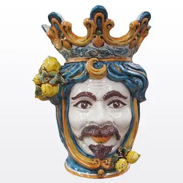 Sicilian Moorish head with lemons. It features a male character decorated in rich shades of blue and orange. It is handcrafted in Caltagirone, Italy. Large