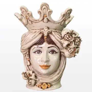 Sicilian Moorish head with pomegranates. It features a female character decorated in rich shades of antique ivory. It is handcrafted in Caltagirone, Italy.