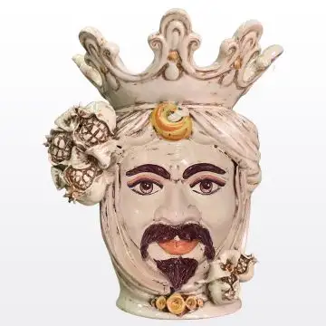 Sicilian Moorish head with pomegranates. It features a male character decorated in rich shades of antique ivory. It is handcrafted in Caltagirone, Italy.