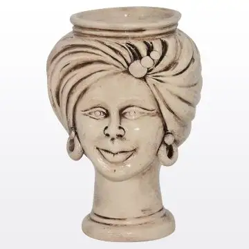 Sicilian Moorish head featuring a female character decorated in shades of antique ivory. It is handcrafted in Caltagirone, Italy.