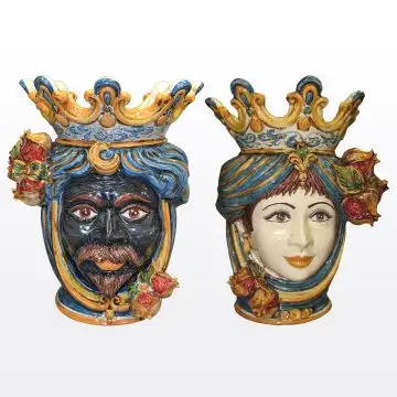 Pair of Sicilian Moorish heads with pomegranates. They feature a man and a woman decorated in rich shades of blue and orange. Handcrafted in Caltagirone, Italy.