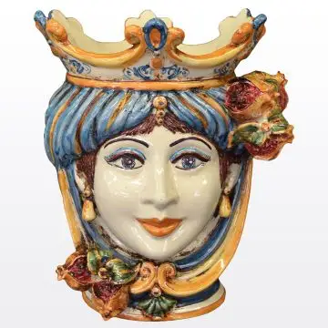 Sicilian Moorish head with pomegranates. It features a female character decorated in rich shades of blue and orange. It is handcrafted in Caltagirone, Italy. Small
