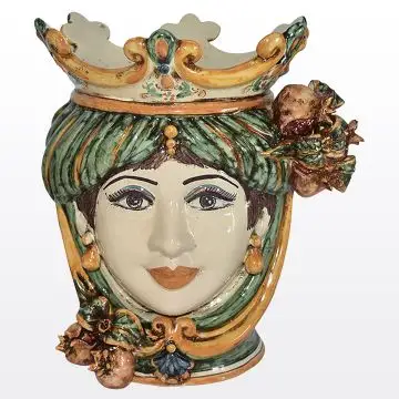 Sicilian Moorish head with pomegranates. It features a female character decorated in rich shades of green and orange. It is handcrafted in Caltagirone, Italy. Small