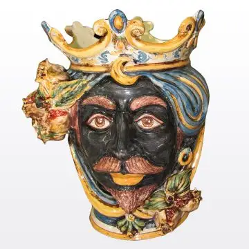Sicilian head with pomegranates. It features a Moorish character decorated in rich shades of blue and orange. It is handcrafted in Caltagirone, Italy. Small