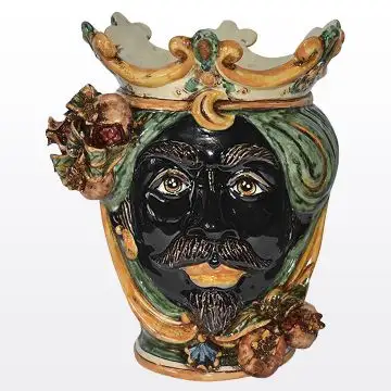 Sicilian head with pomegranates. It features a Moorish character decorated in rich shades of green and orange. It is handcrafted in Caltagirone, Italy. Small