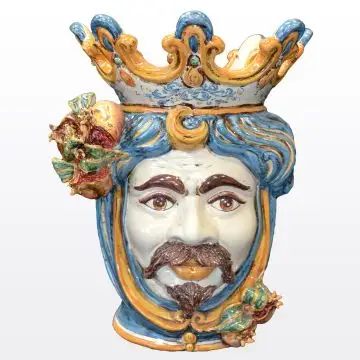 Sicilian Moorish head with pomegranates. It features a male character decorated in rich shades of blue and orange. It is handcrafted in Caltagirone, Italy. Large