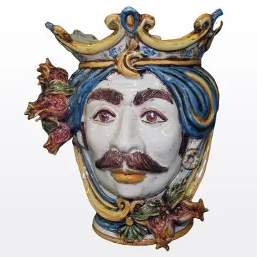 Sicilian Moorish head with pomegranates. It features a male character decorated in rich shades of blue and orange. It is handcrafted in Caltagirone, Italy. Small