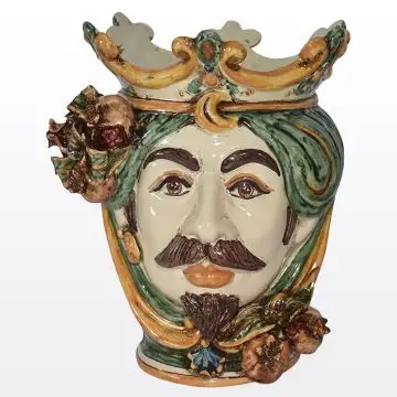 Sicilian Moorish head with pomegranates. It features a male character decorated in rich shades of green and orange. It is handcrafted in Caltagirone, Italy. Small