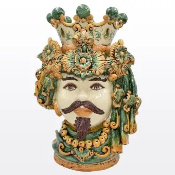 Regal Sicilian Moorish head featuring a male characterdecorated in rich shades of green and orange. It is handcrafted in Caltagirone, Italy.