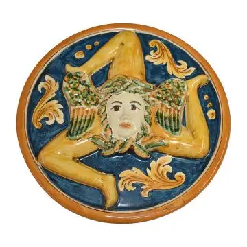 A handmade Sicilian plaque featuring a Trinacria, the three-legged symbol of Sicily. Handmade in Caltagirone, Italy