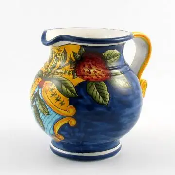 Tuscan pitcher from the Frutti Blu collection featuring fruit and leaves on a blue background, handmade by Ima in Montelupo Fiorentino - Italy
