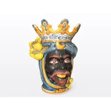Sicilian head with lemons. It features a Moorish character decorated in rich shades of blue and orange. It is handcrafted in Caltagirone, Italy. Large