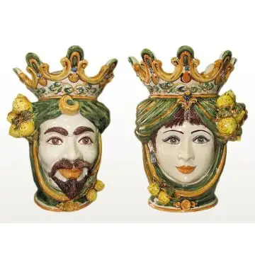 Pair of Sicilian Moorish heads with lemons. They feature a female and a male character decorated in rich shades of green and orange. Handcrafted in Caltagirone, Italy.