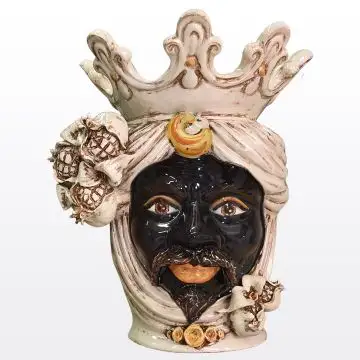 Sicilian head with pomegranates. It features a Moorish character decorated in rich shades of antique ivory. It is handcrafted in Caltagirone, Italy.