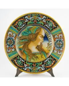 Italian wall plate featuring a Renaissance-style portrait of Lucrezia handmade by Alvaro Binaglia in Deruta Italy - main image