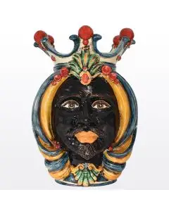 Sicilian head featuring a Moorish character decorated in rich shades of blue, orange and red. It is handcrafted in Caltagirone, Italy.