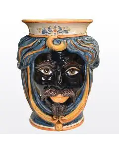 Sicilian head vase featuring a Moorish character decorated in rich shades of blue and orange. It is handcrafted in Caltagirone, Italy.