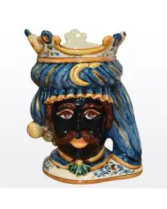 Sicilian head vase featuring a Moorish character decorated in rich shades of blue and orange. It is handcrafted in Caltagirone, Italy.