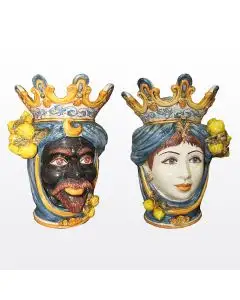 Pair of Sicilian Moorish heads with lemons. They feature a man and a woman decorated in rich shades of blue and orange. Handcrafted in Caltagirone, Italy.