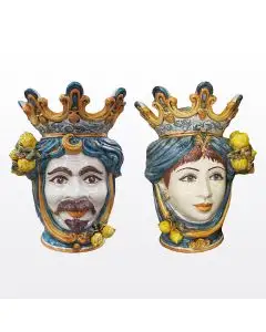 Pair of Sicilian Moorish heads with lemons. They feature a female and a male character decorated in rich shades of blue and orange. Handcrafted in Caltagirone, Italy.