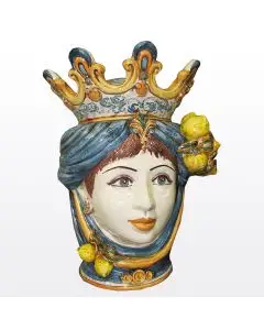 Sicilian Moorish head with lemons. It features a female character decorated in rich shades of blue and orange. It is handcrafted in Caltagirone, Italy. Large