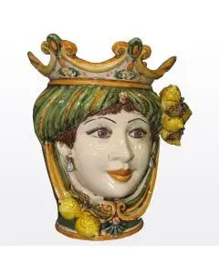 Sicilian Moorish head with lemons. It features a female character decorated in rich shades of green and orange. It is handcrafted in Caltagirone, Italy. Small