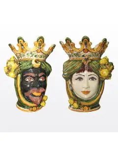Pair of Sicilian Moorish heads with lemons. They feature a man and a woman decorated in rich shades of green and orange. Handcrafted in Caltagirone, Italy.