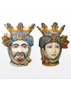 Pair of Sicilian Moorish heads with pomegranates. They feature a female and a male character decorated in rich shades of blue and orange. Handcrafted in Caltagirone, Italy.