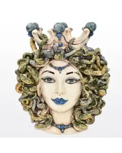 Sicilian ceramic head featuring Medusa, with snakes for hair and the ability to turn anyone who looks directly at her to stone. It is decorated with antique, mother-of-pearl glazes, which add depth and shine to its fine features.