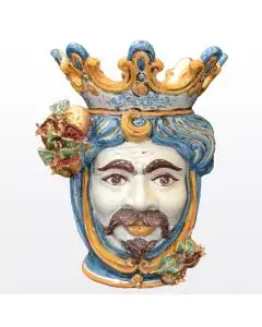 Sicilian Moorish head with pomegranates. It features a male character decorated in rich shades of blue and orange. It is handcrafted in Caltagirone, Italy. Large