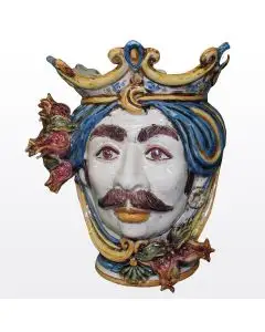 Sicilian Moorish head with pomegranates. It features a male character decorated in rich shades of blue and orange. It is handcrafted in Caltagirone, Italy. Small
