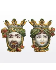 Pair of Sicilian Moorish heads with pomegranates. They feature a female and a male character decorated in rich shades of green and orange. Handcrafted in Caltagirone, Italy.