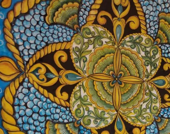 Detail of a large ceramic platter, hand-painted by Andrilia in Deruta