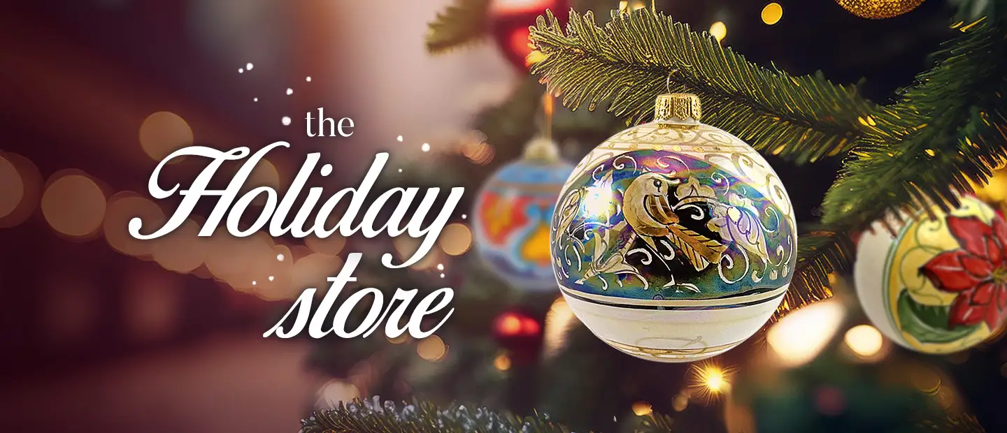 A Christmas tree decorated with Italian hand-painted Christmas ball ornaments