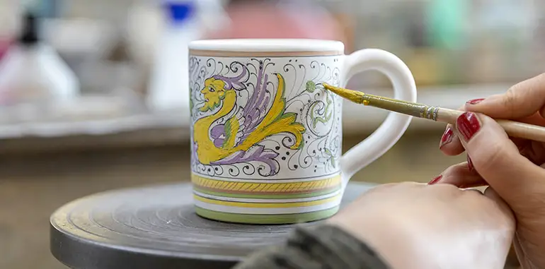 A ceramic artist working in Fima's Bottega in Deruta