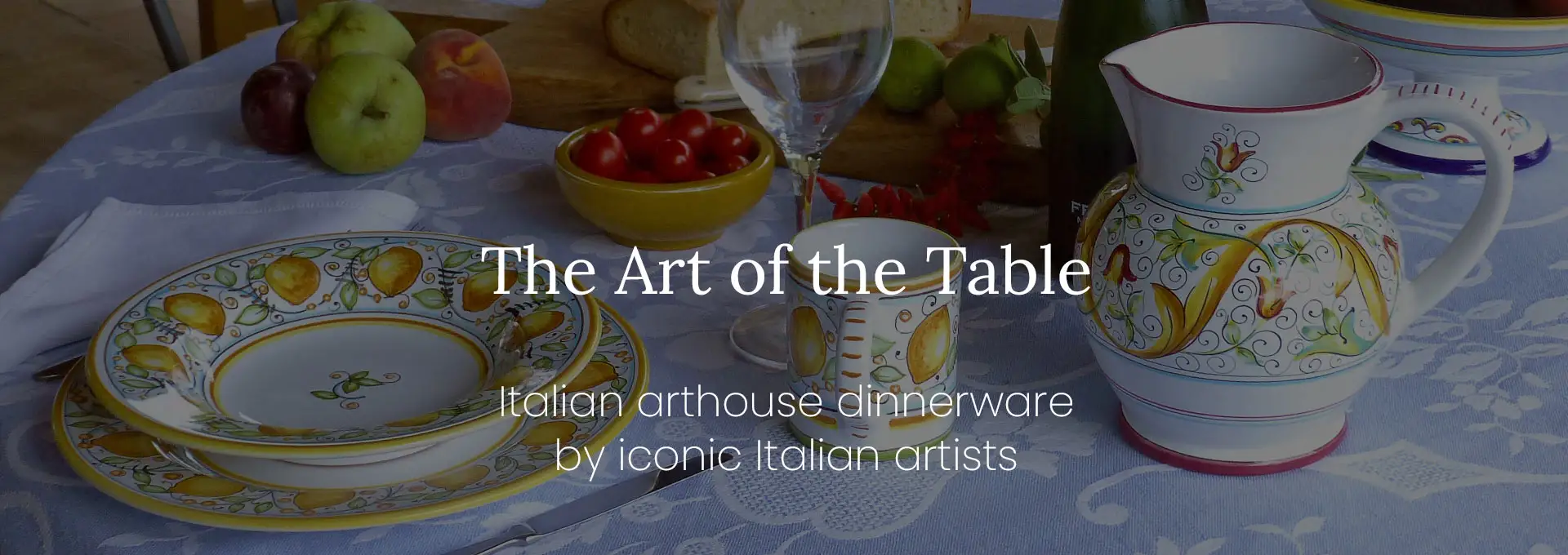 A table set with the Limoni Italian hand-painted dinnerware and the Primizia pitcher by Fima Deruta.