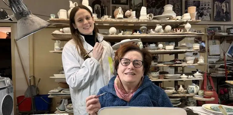 Artists Rossana and Giulia Rampini painting in their ceramic studio in Gubbio